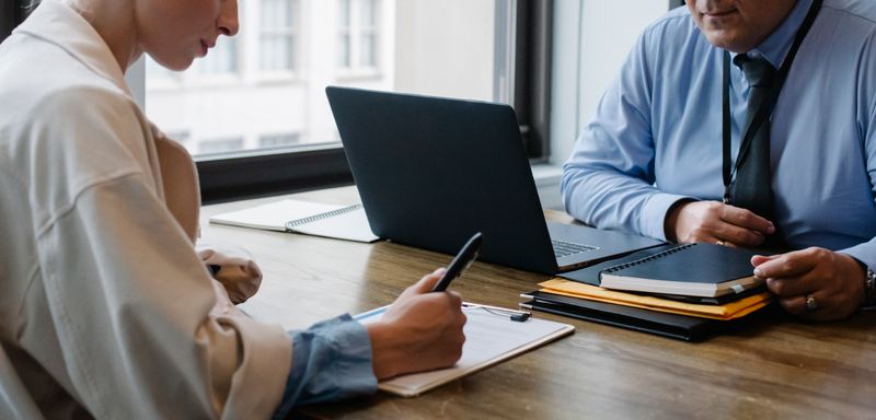 Business partners reviewing project documents
